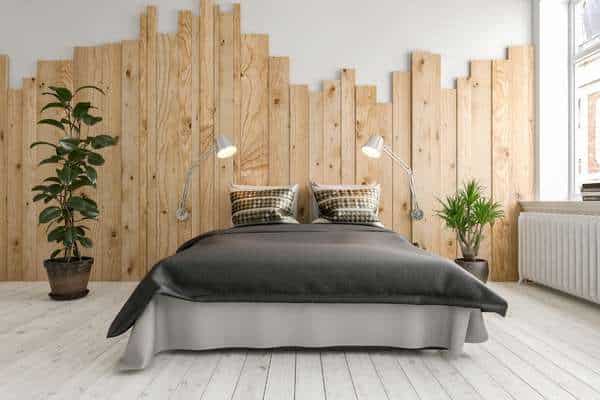 Different types of wood will help to decorate the bedroom wall
