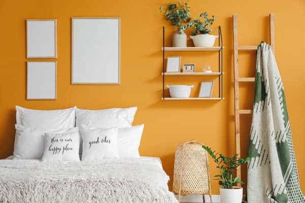 use orange color for the back wall of the bedroom